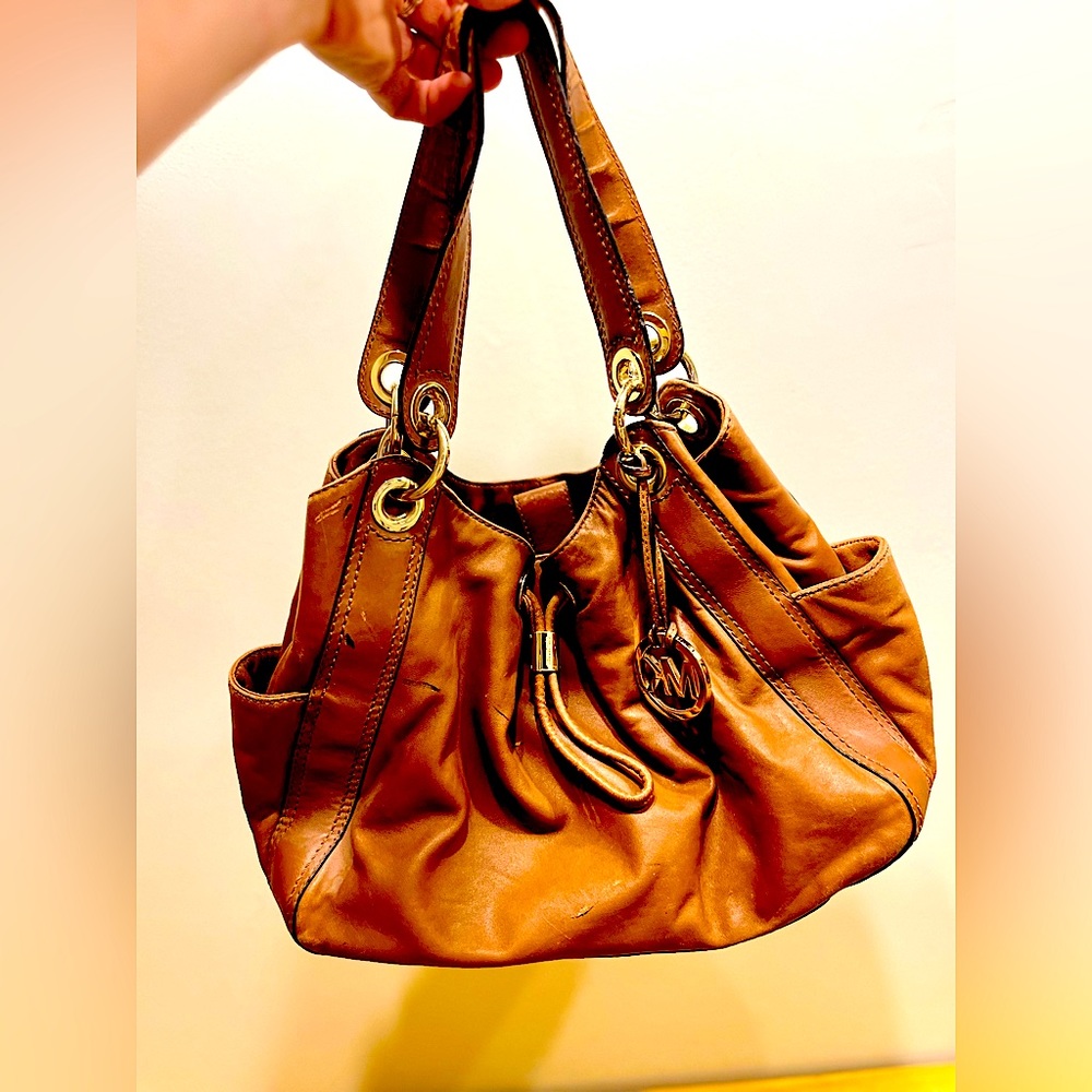 MICHAEL KORS authentic brown leather handbag with gold details and MK charm